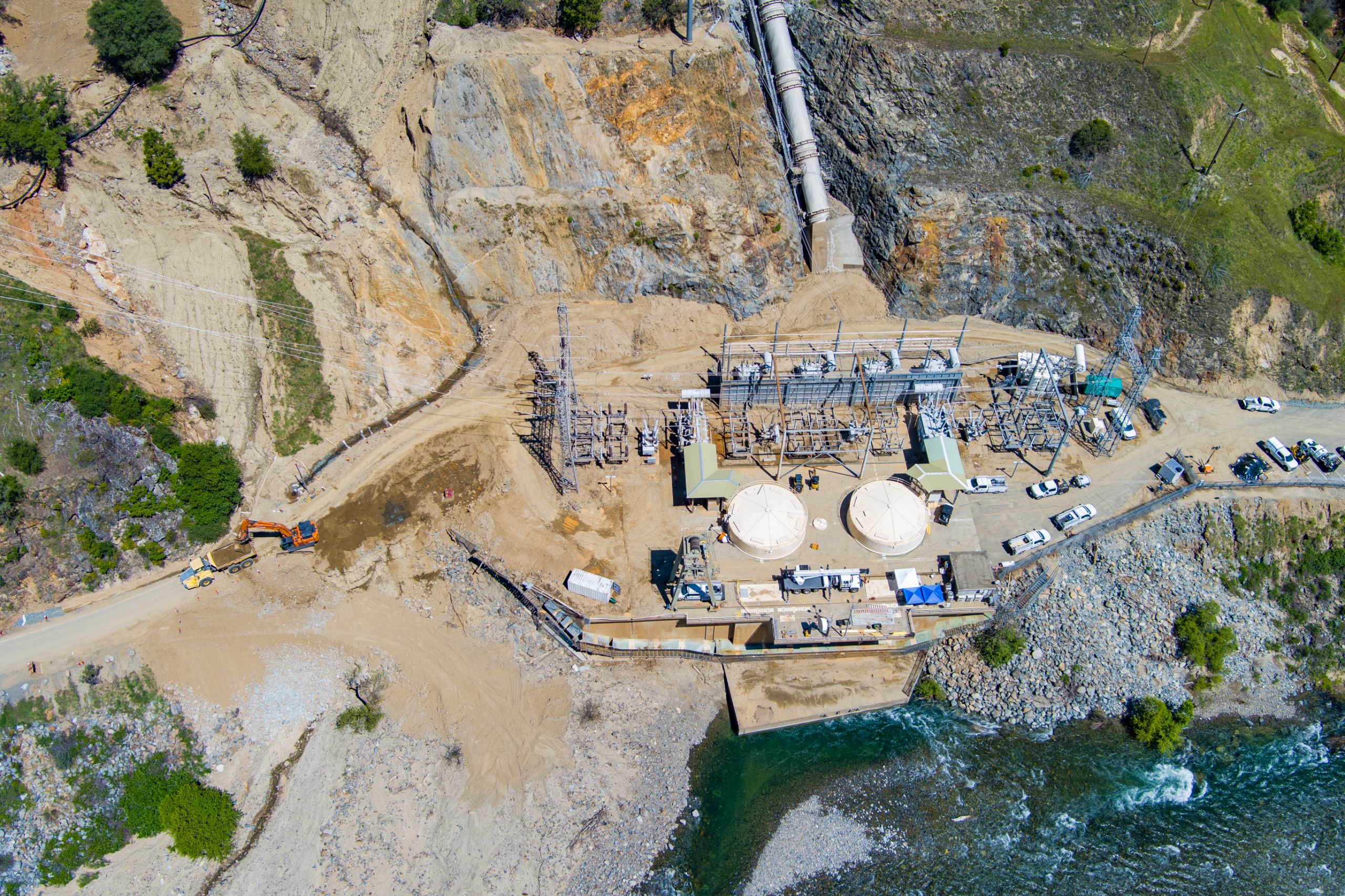 An aerial view looking down at sediment removal work around Yuba Water's New Colgate powerhouse on the Yuba River. 